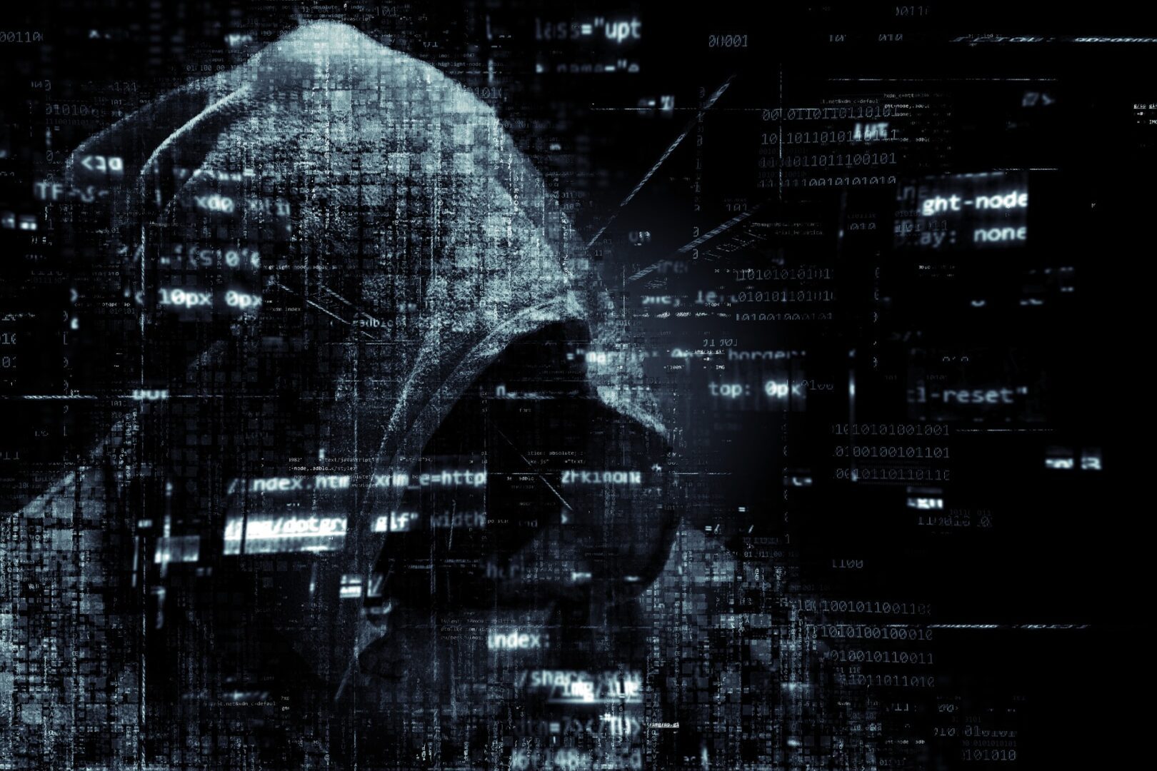 A man in a black hoodie, a hacker concept